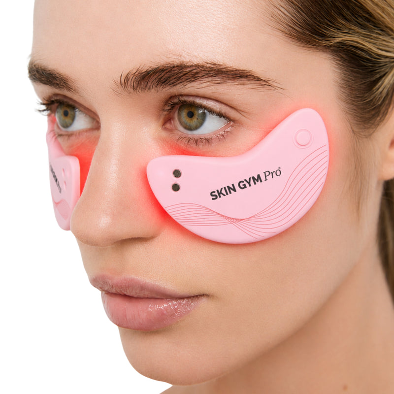 Woman wearing Skin Gym LED light therapy eye patches under her eyes during 10-minute treatment
